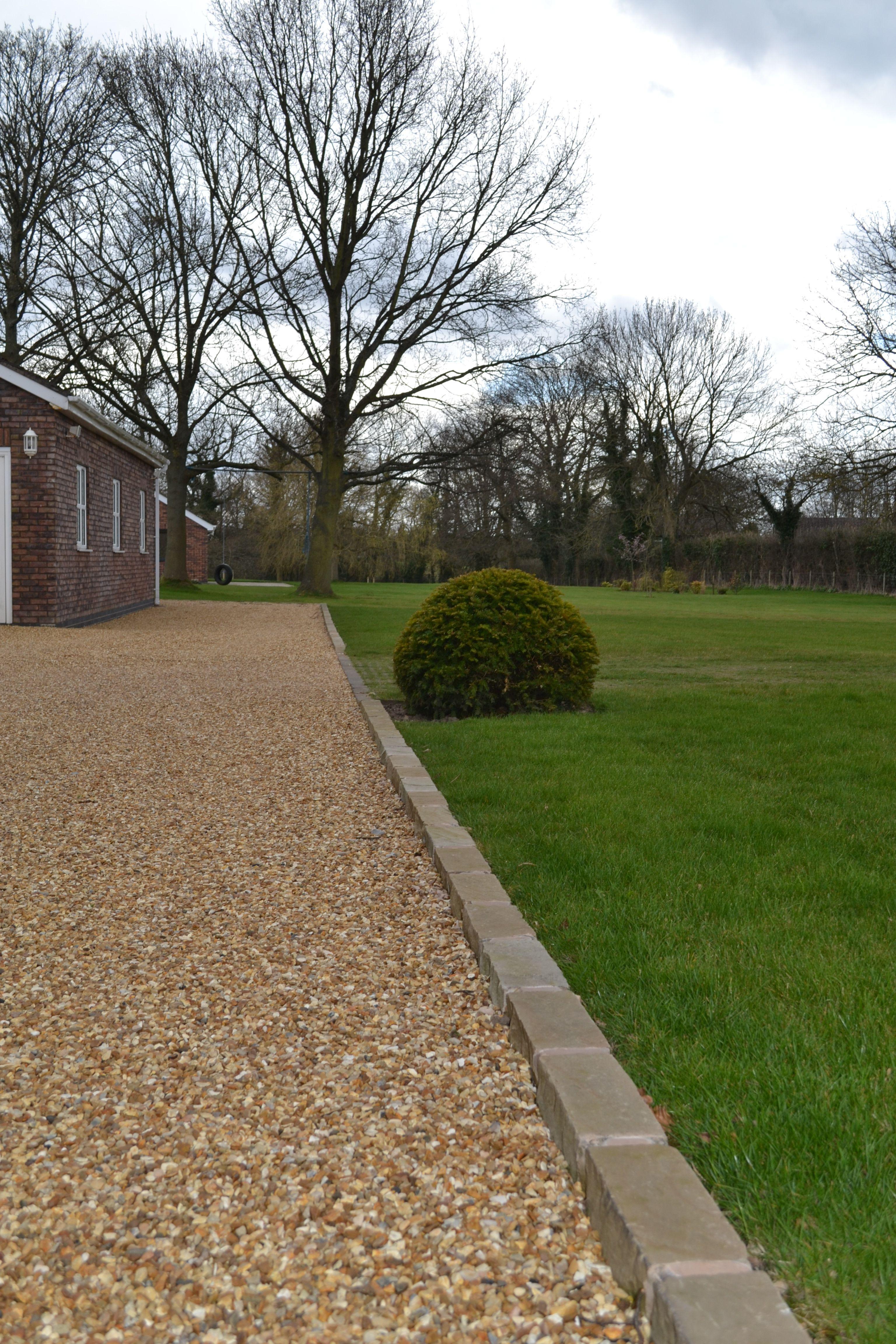 completed gravel driveway installation for residential property